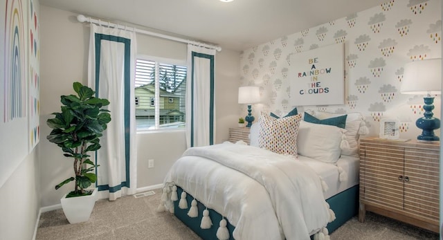 bedroom with light colored carpet