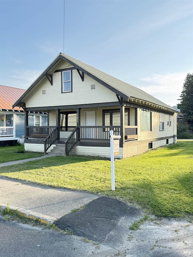 202 S Central Ave, Ione, WA 99139 - view of front of house with a porch and a front yard