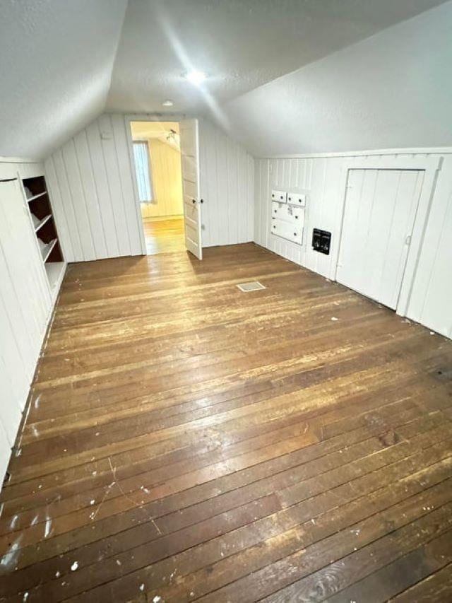 202 S Central Ave, Ione, WA 99139 - bonus room featuring hardwood / wood-style flooring, lofted ceiling, and wood walls