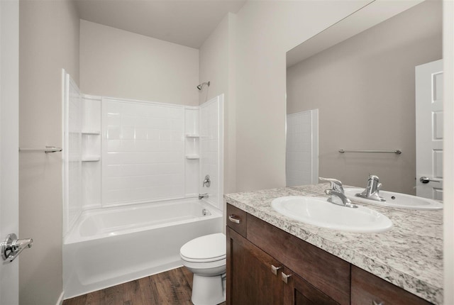 full bathroom featuring toilet, vanity, wood-type flooring, and tub / shower combination