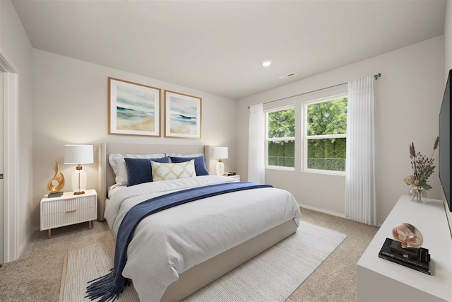 bedroom featuring light colored carpet