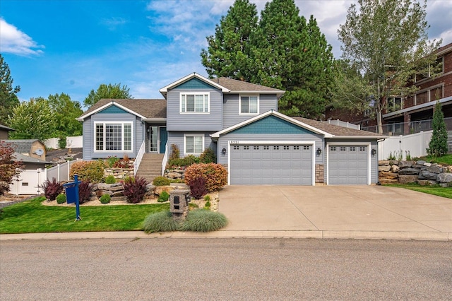 view of front of property featuring a front yard and a garage