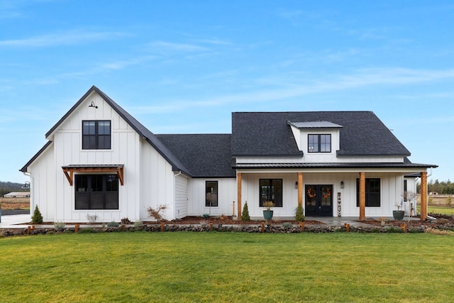 modern farmhouse style home featuring a front lawn and a porch