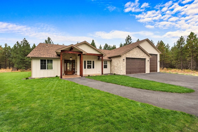 view of front facade with a front yard and a garage