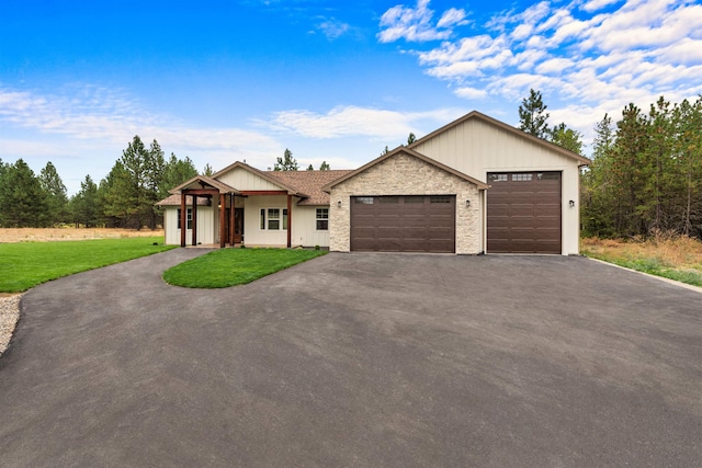 view of front of property with a garage and a front yard