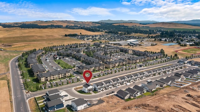 birds eye view of property featuring a mountain view