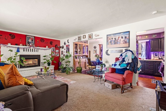 living room with wood-type flooring and a fireplace