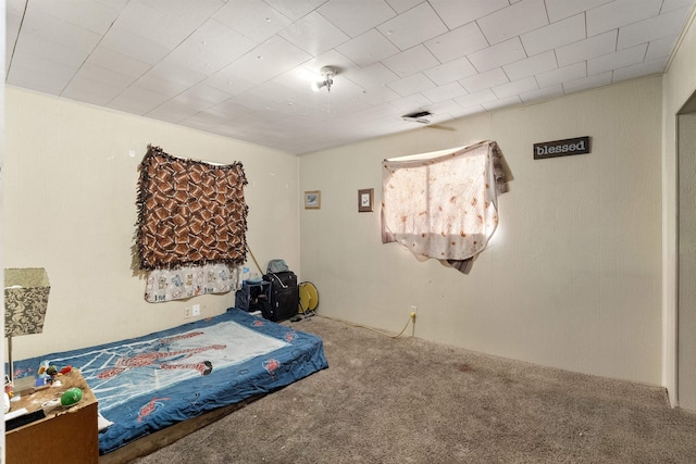 bedroom featuring visible vents and carpet flooring