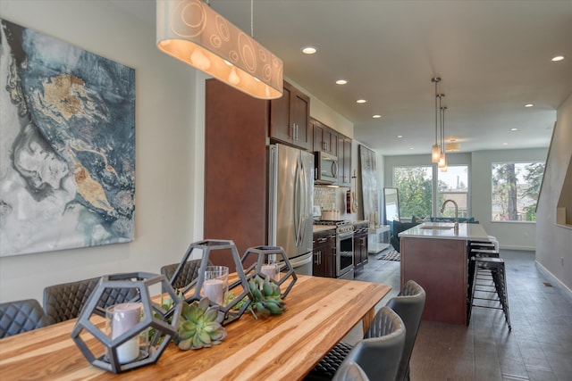 dining space featuring sink