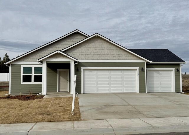 view of front facade with a garage and a front lawn