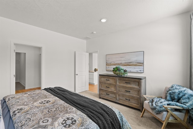 bedroom featuring light colored carpet