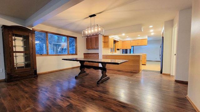 interior space featuring dark wood-type flooring, recessed lighting, baseboards, and a sink