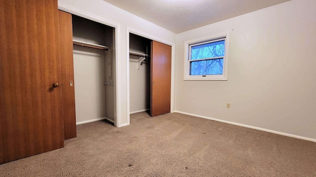 unfurnished bedroom with baseboards and carpet floors