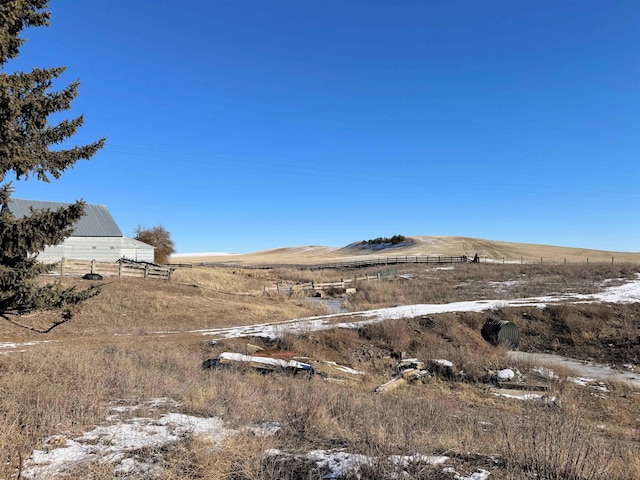 view of yard featuring a mountain view and a rural view