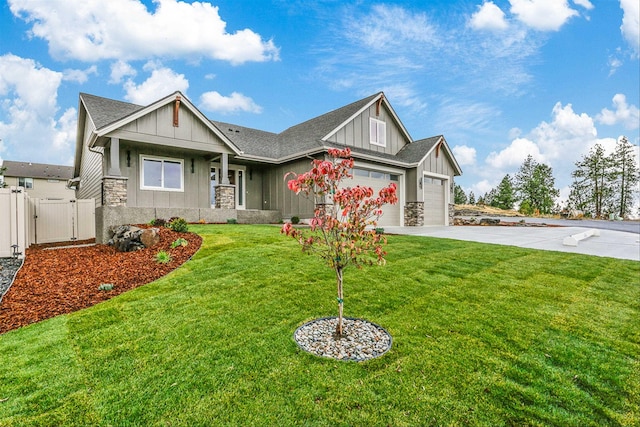 16924 E 16th Ln, Spokane Valley, WA 99037 - craftsman house with board and batten siding, a gate, an attached garage, concrete driveway, and stone siding