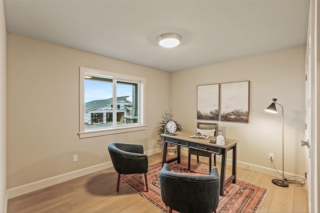 office with hardwood / wood-style flooring