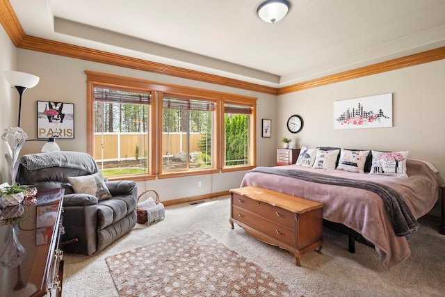 carpeted bedroom with ornamental molding and multiple windows