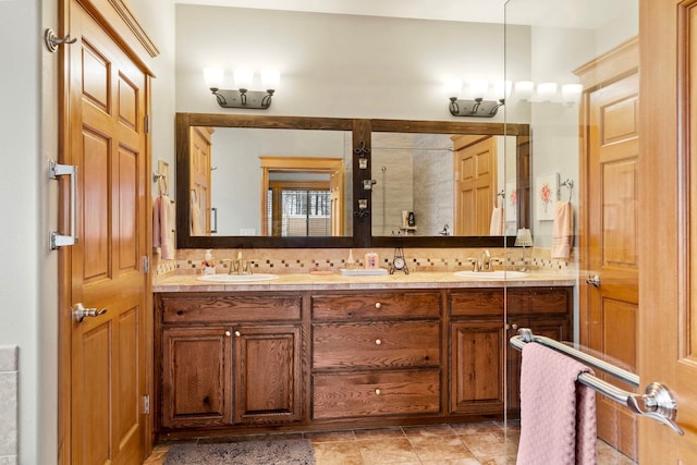 bathroom with backsplash, walk in shower, and vanity