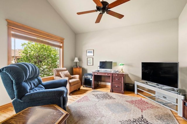 office space with vaulted ceiling, ceiling fan, and light wood-type flooring