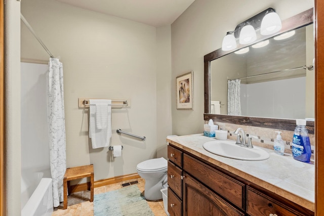 full bathroom with toilet, vanity, tile patterned flooring, and shower / tub combo