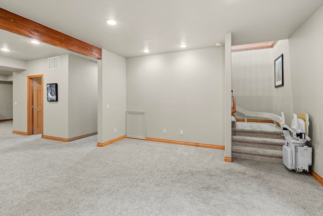 basement featuring light carpet