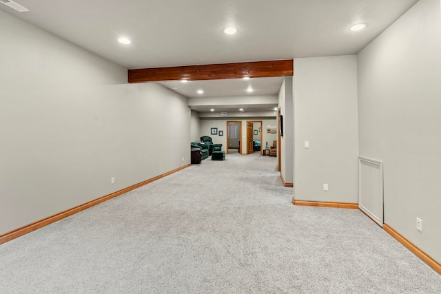 basement featuring light carpet