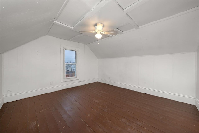 additional living space featuring ceiling fan, dark wood-type flooring, and vaulted ceiling