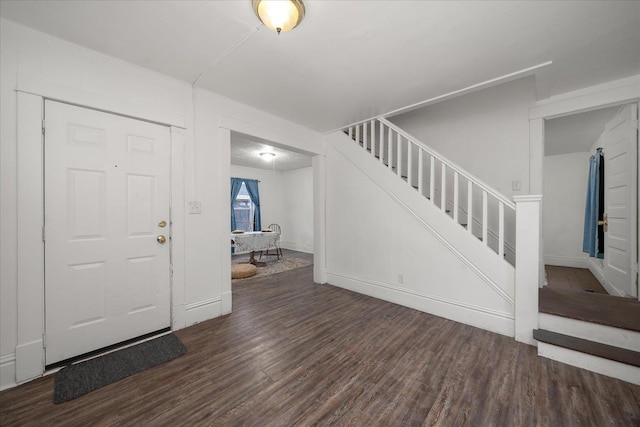 entryway with dark wood-type flooring