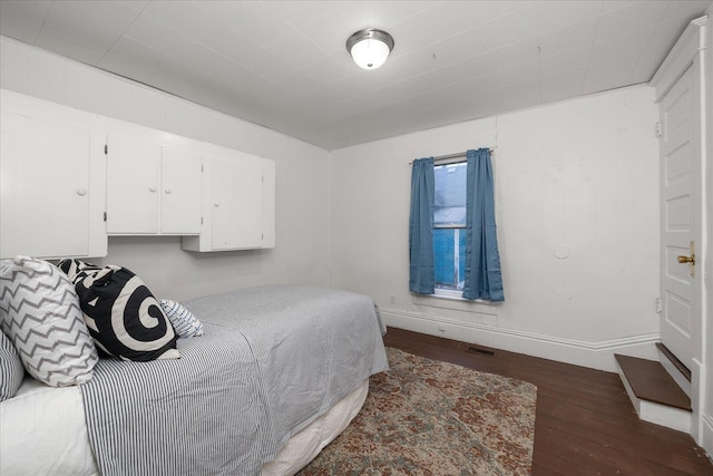 bedroom featuring dark hardwood / wood-style floors