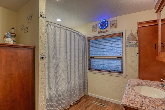 kitchen featuring tile countertops, crown molding, sink, and stainless steel appliances