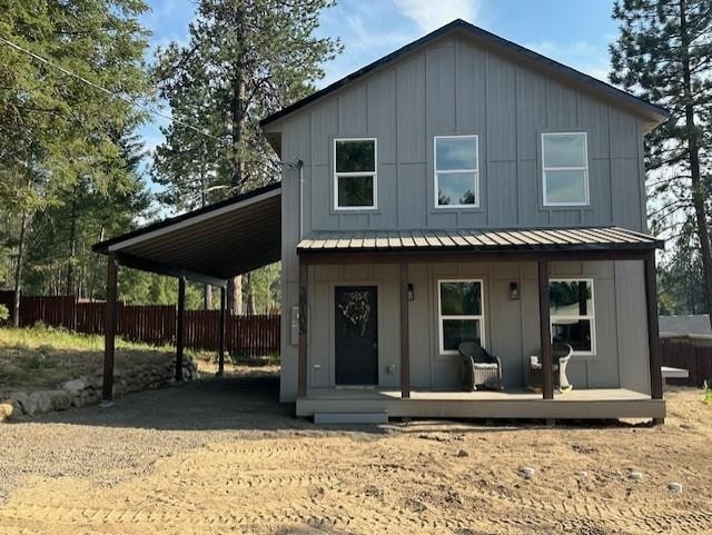 38105 N Frontage Rd, Elk, WA 99009 - view of front of property featuring board and batten siding, a porch, a standing seam roof, and a metal roof