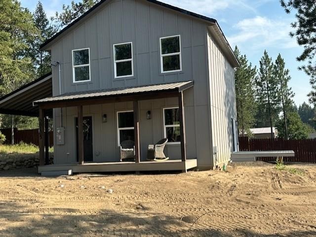 38105 N Frontage Rd, Elk, WA 99009 - view of front of home with a porch, board and batten siding, and a metal roof