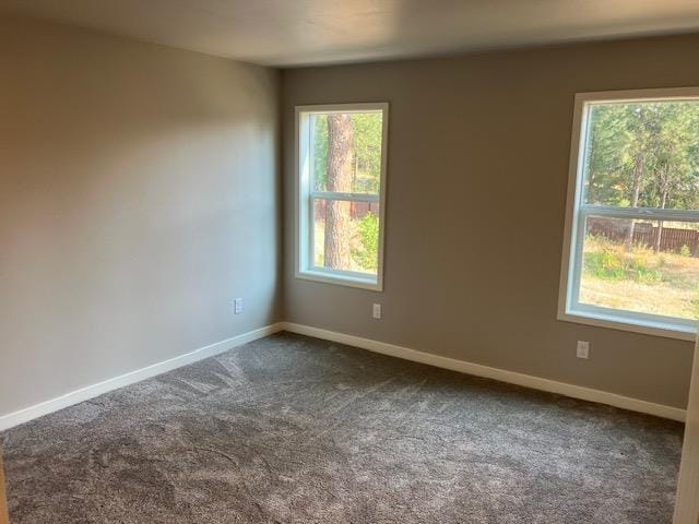 38105 N Frontage Rd, Elk, WA 99009 - spare room with dark carpet and baseboards