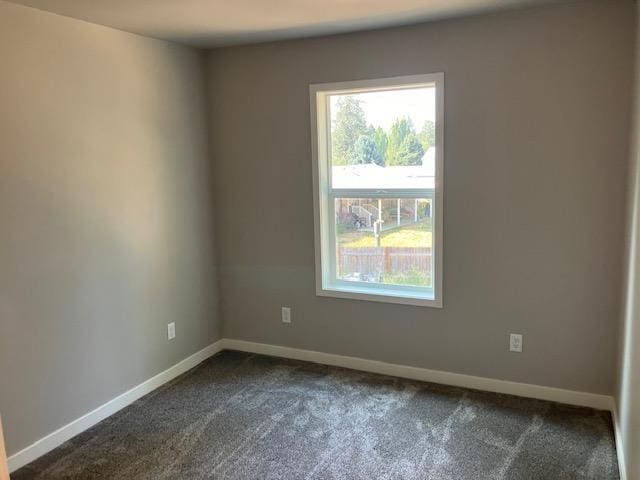38105 N Frontage Rd, Elk, WA 99009 - empty room featuring dark carpet and baseboards