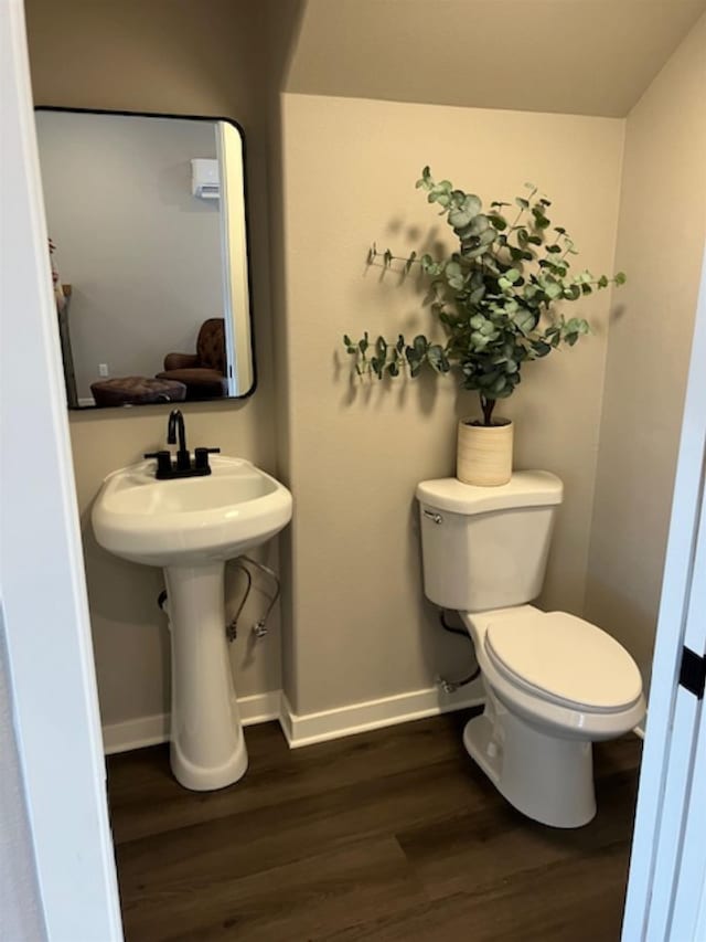 38105 N Frontage Rd, Elk, WA 99009 - half bath with wood finished floors and toilet