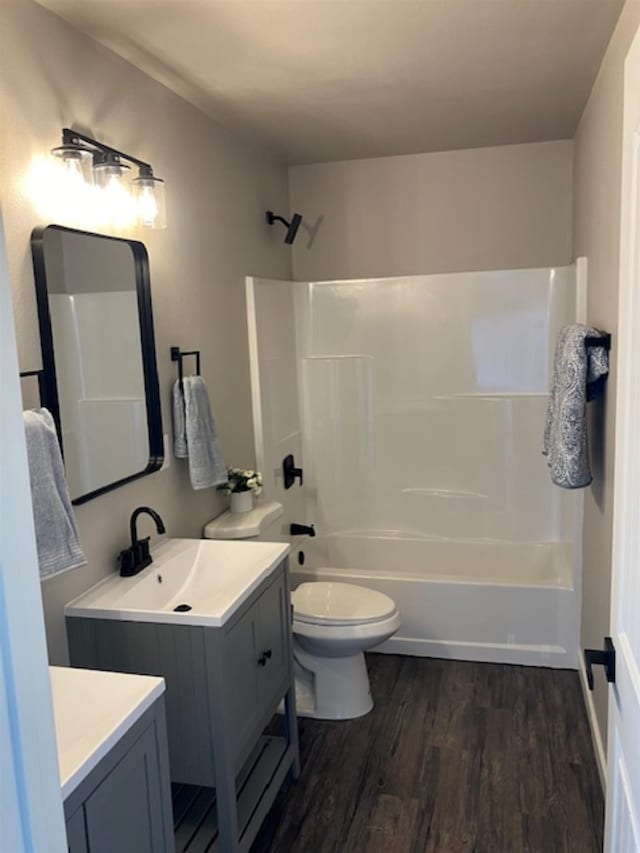 38105 N Frontage Rd, Elk, WA 99009 - bathroom with wood finished floors, vanity, and shower / washtub combination