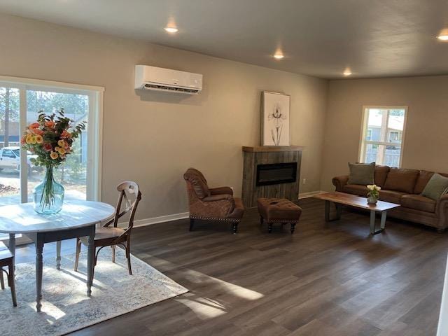 38105 N Frontage Rd, Elk, WA 99009 - dining space with an AC wall unit, healthy amount of natural light, dark wood-style floors, a tile fireplace, and recessed lighting