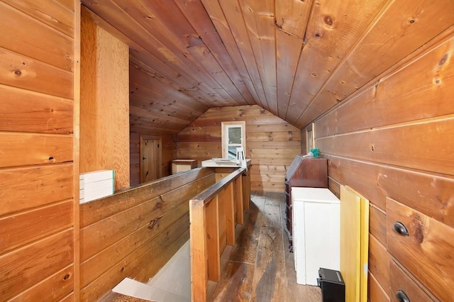 bonus room featuring wooden walls, dark hardwood / wood-style floors, lofted ceiling, and wood ceiling