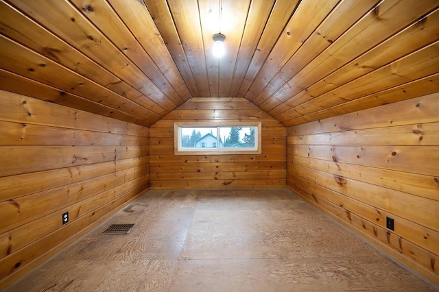 additional living space with wooden walls, wooden ceiling, and lofted ceiling