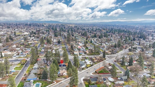 birds eye view of property with a mountain view