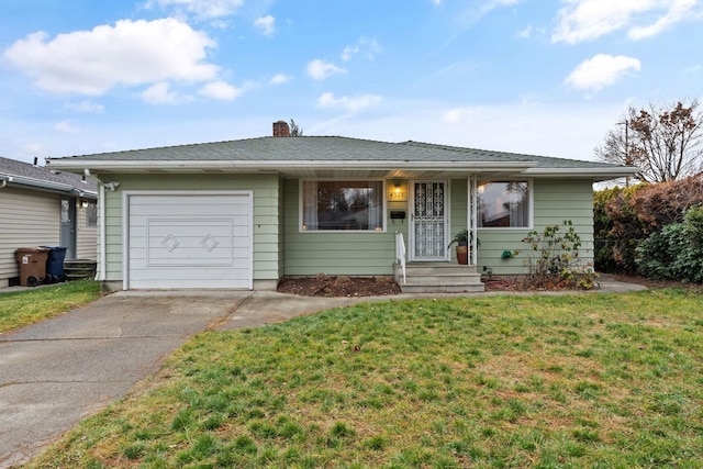 ranch-style home featuring a garage and a front lawn