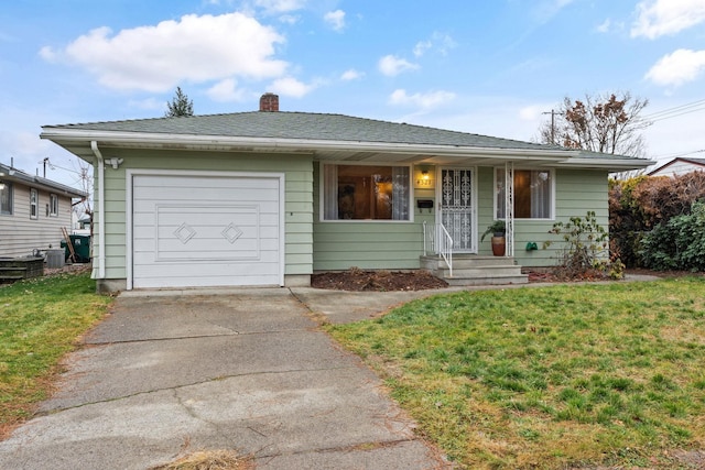 view of front facade with a garage and a front yard