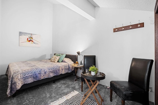 bedroom featuring carpet and a textured ceiling