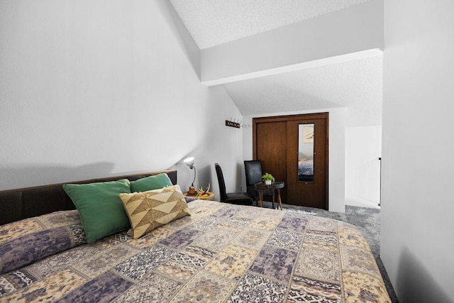 bedroom featuring carpet flooring, lofted ceiling with beams, and a textured ceiling