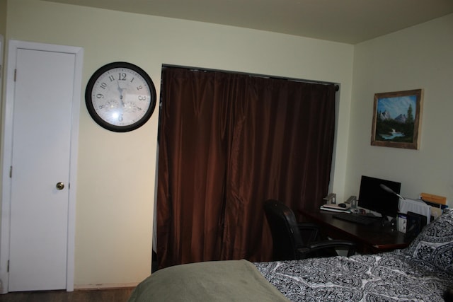 bedroom with hardwood / wood-style flooring