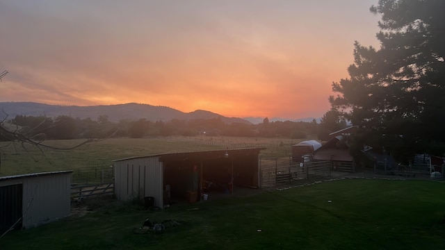 outdoor structure at dusk featuring a mountain view