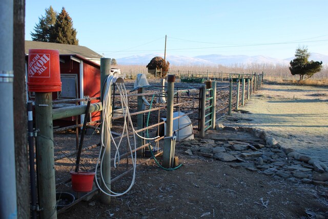 exterior space with a mountain view and a rural view