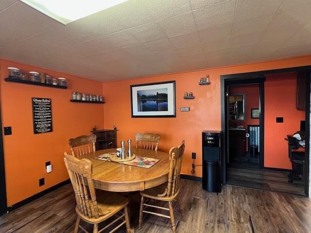 dining area with dark wood-type flooring