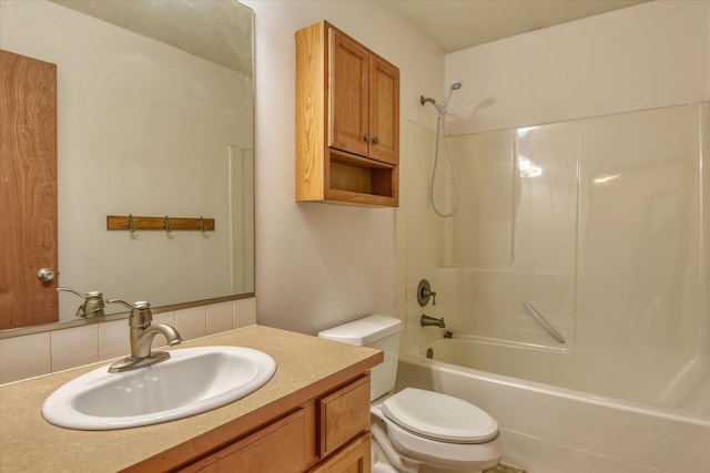 full bathroom with vanity, toilet, and bathtub / shower combination