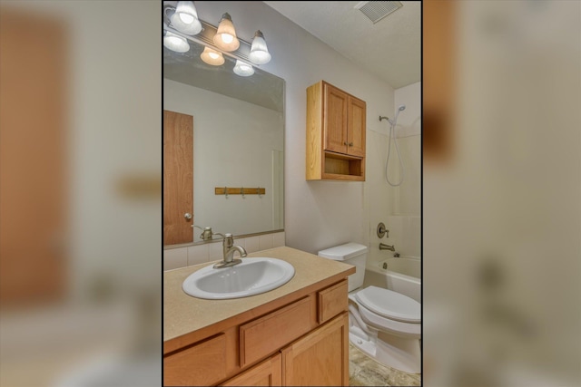 full bathroom with bathtub / shower combination, vanity, and toilet